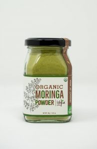 Organic moringa powder in a jar from Ishka Farms