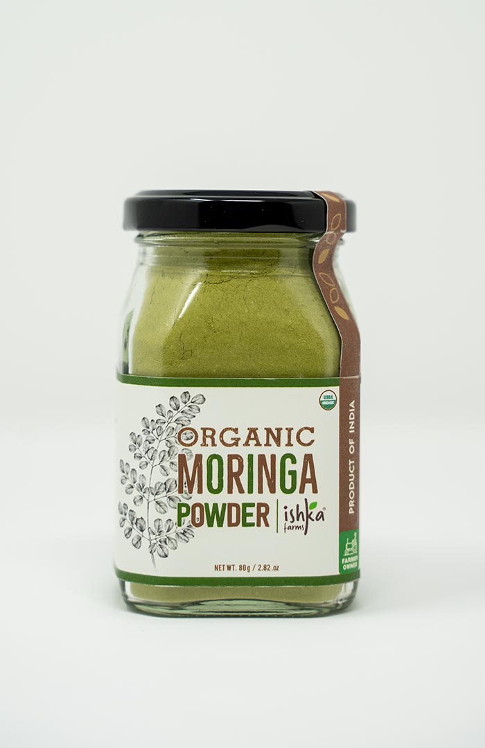 Organic moringa powder in a jar from Ishka Farms